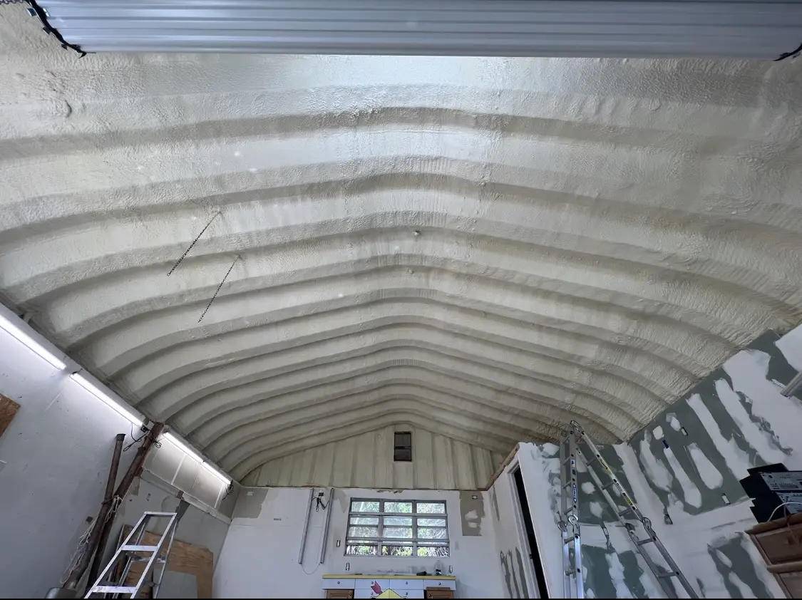 Spray polyurethane foam applied to the underside of a metal roof deck in Union City